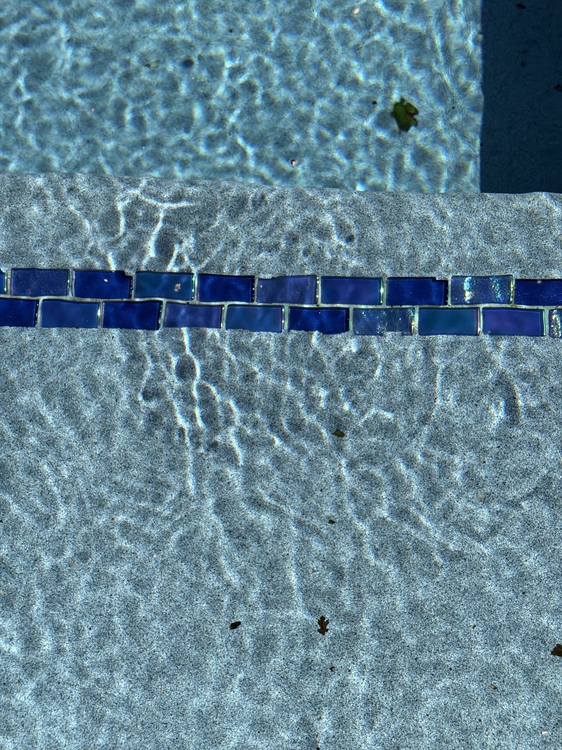 EcoFinish pool steps seven years after installation in Liberty City Texas