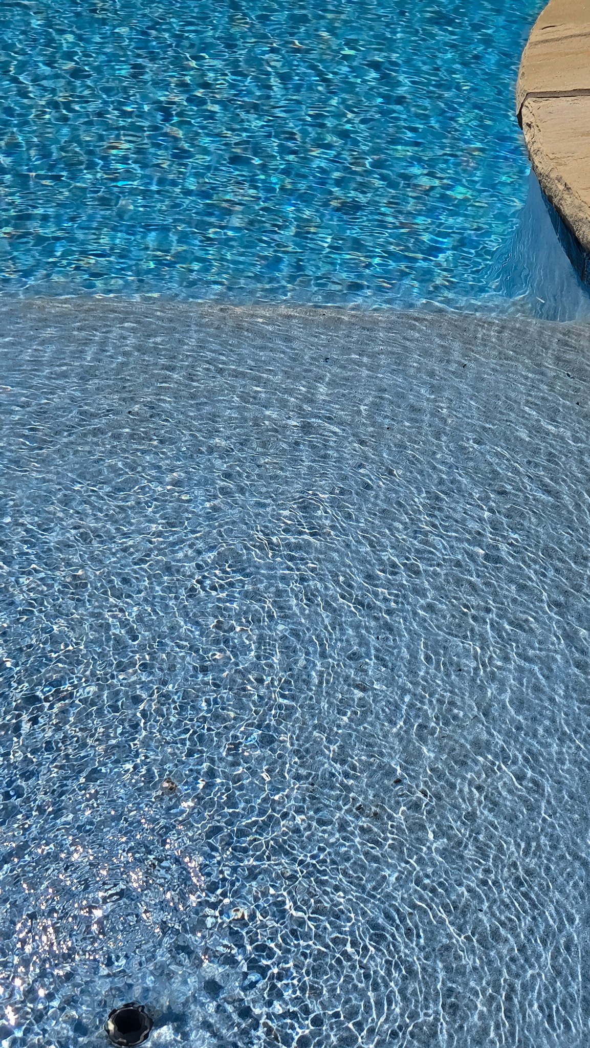 EcoFinish wear visible on a swimming pool step