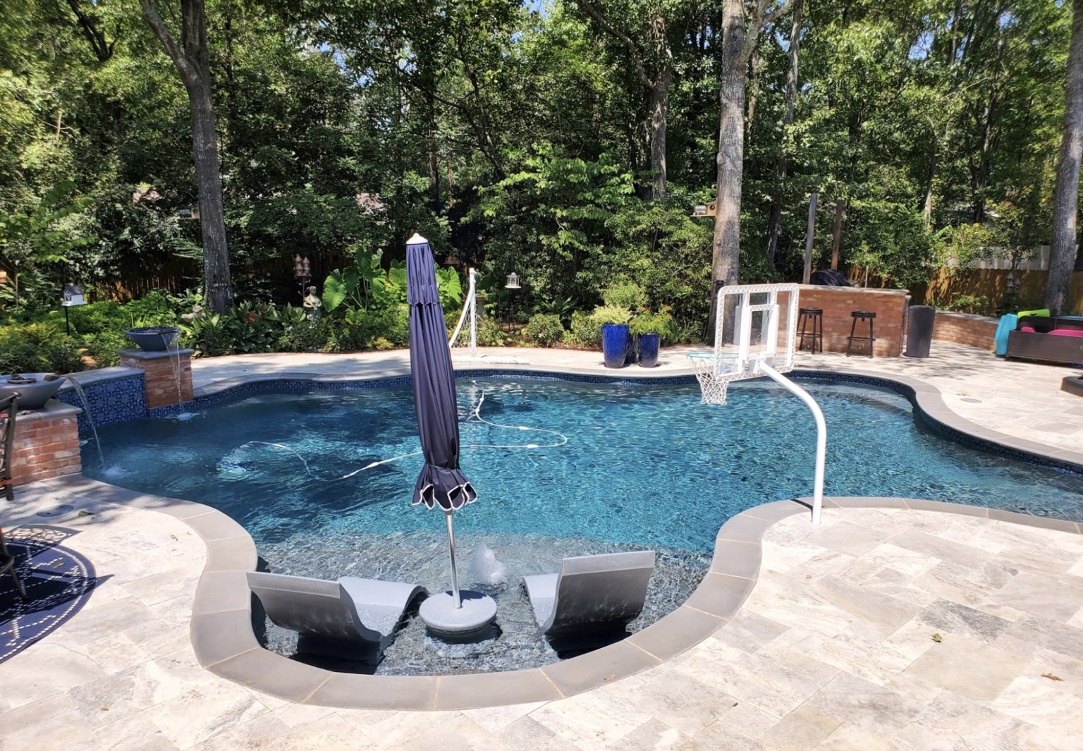 Pebble pool finish on a completed swimming pool in Tyler, Texas