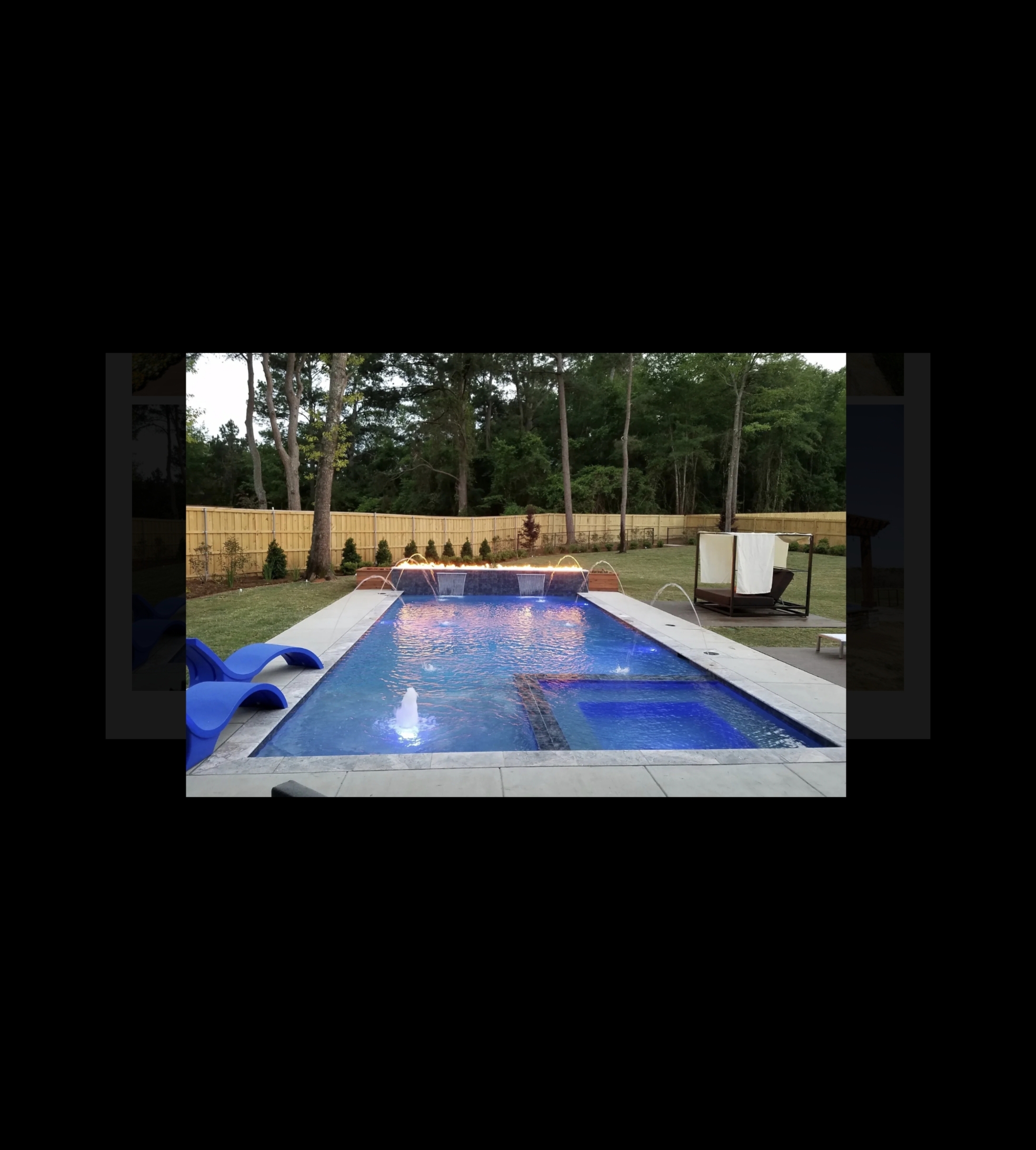 Midnight Blue Quartzscapes pool with travertine coping