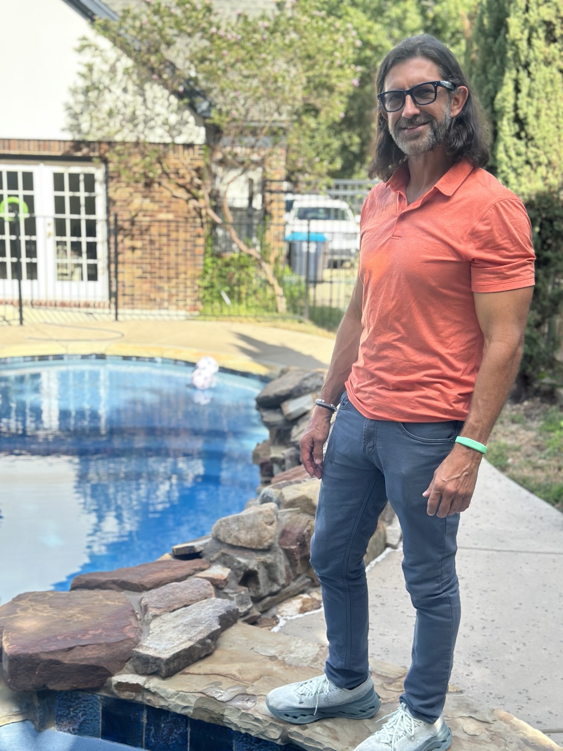 Matt Phillips beside a swimming pool during a pool inspection